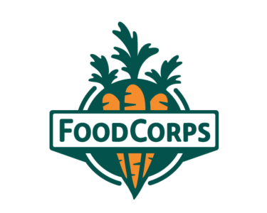 Green, white, and orange logo with  FoodCorps written in green in front of carrots